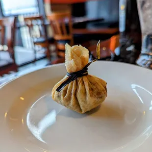 a small bag of food on a plate