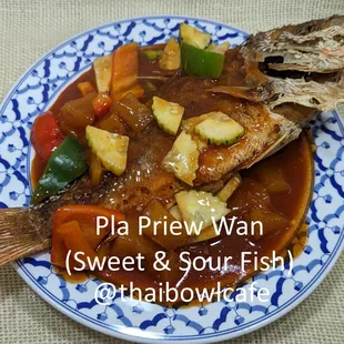 Crispy fish, expertly fried to a golden perfection, topped with a flavorful sweet and sour sauce.