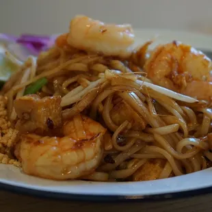a plate of noodles and shrimp