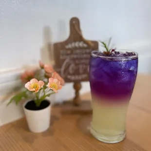 a purple and yellow drink