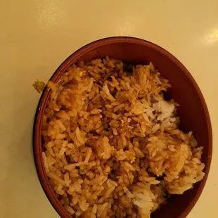a bowl of rice and a spoon