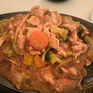 a plate of food with meat and vegetables