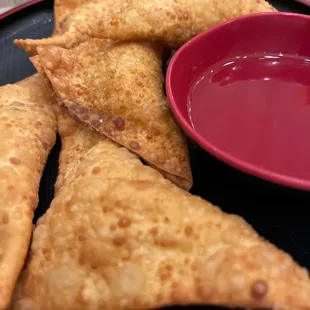 Fried wontons with cream cheese.