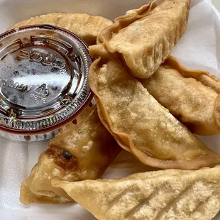 Wonton (pot sticker) stuffed with chopped vegetables and ground chicken.