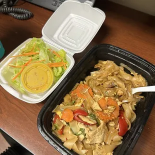 Drunken noodles with chicken, complementary salad.