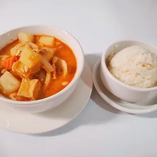 a bowl of stew and a bowl of rice