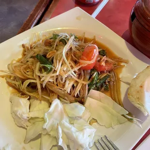 Papaya salad.. flavor is there but a bit too salty.  Medium spicy is more like mild