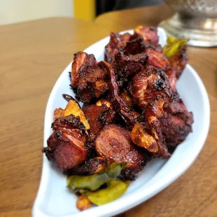 a plate of chicken wings and vegetables