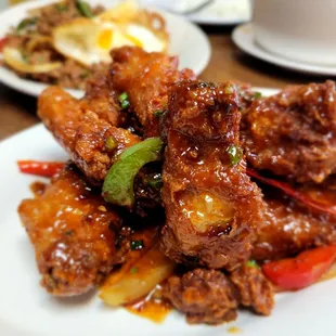 a plate of fried chicken and vegetables