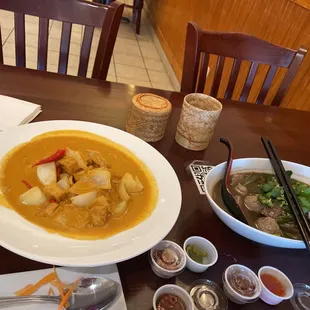 a bowl of soup and a bowl of soup with chopsticks