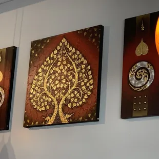 three paintings on the wall