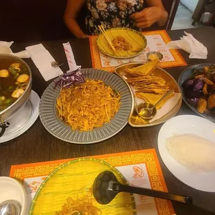 Tom yum soup, pad Thai, fried wontons, spicy eggplants