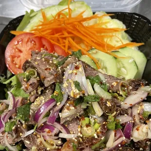 Namtok. Grilled marinated Thai steak  tossed in Thai herbs condiments.Spicy is the best way.Light and flavorful.