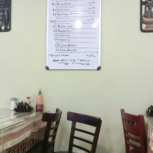 Part of the menu that's hanging on the wall.