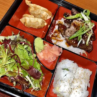 a bento box of food