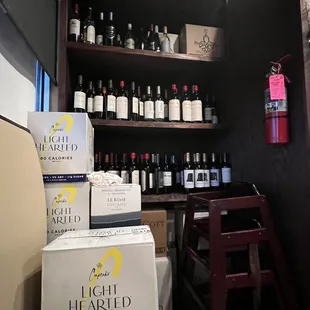 shelves full of wine bottles and wine glasses