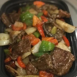 Pepper Tender Beef: Sliced tender beef quickly stir fried with assorted pepper, onion, black pepper sauce