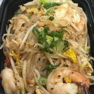 Pad Thai plus more spicy: a famous rice noodle dish with chicken , shrimp, egg, bean sprout, peanut