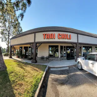 a car parked in front of a restaurant