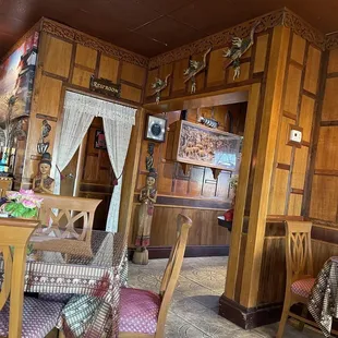 a dining room with a table and chairs