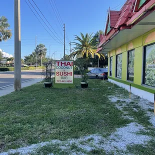 a sign in front of a business