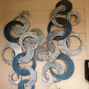 a variety of metal rings on a wall