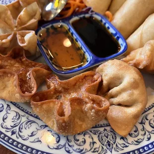 Sampler plate: crab , thai egg rolls, cream cheese with shrimp and gyozas