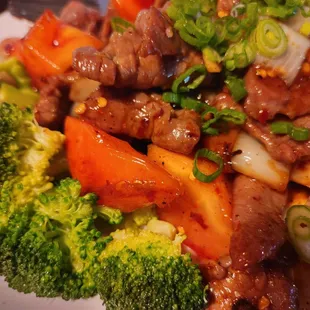 beef, broccoli, and carrots on a plate