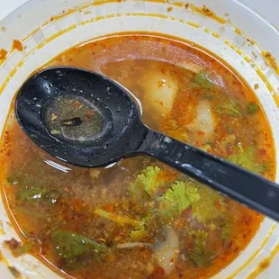 a bowl of soup with a spoon