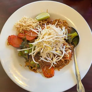 a plate of noodles and vegetables