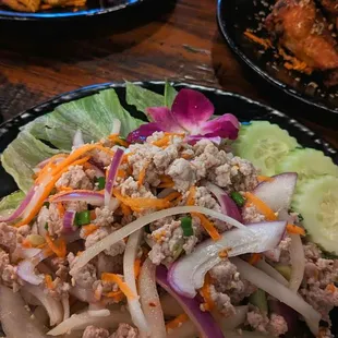 Laab salad with sweet and sour tofu in the back