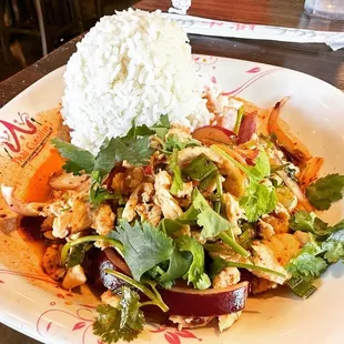 a plate of food with rice and vegetables