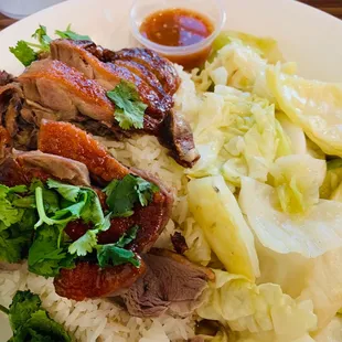 Me . Don't judge me. I always order a bunch and take it to go later. Call me greedy   Duck with rice and cabbage. Bommmmmmmmb