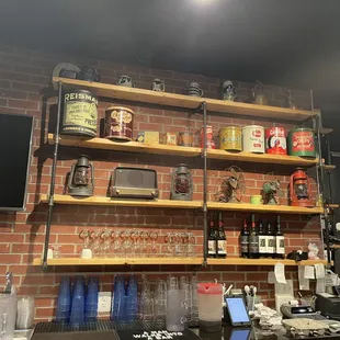 a brick wall with shelves and a television