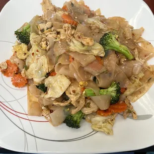 Wide spicy noodles with chicken, mild spice, so good!