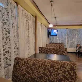 the dining area with a flat screen tv