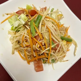 a plate of noodles and vegetables