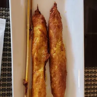 Chicken satay (like fried chicken) with peanut sauce.