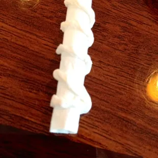 The straw wrappers she made it into origami art I received it on my straw