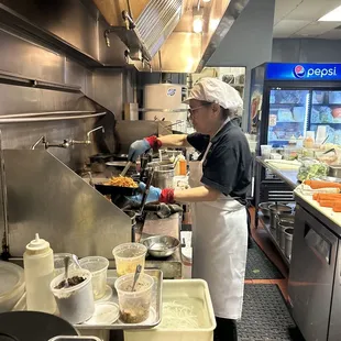 This is the photo they sent me minutes later. Notice, hair net and plastic gloves. Thats fair. Im not working back there.