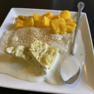 Syrupy mango from a bag, viscous cream, a sticky rice-like glob, and some kind of unidentifiable pastry. Disgusting.