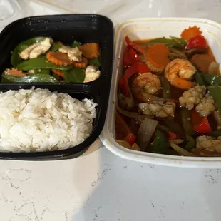 two containers with rice and vegetables