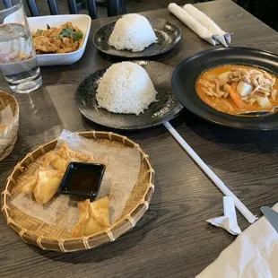 Crab Rangoon, Massaman curry with chicken, and basil pork.