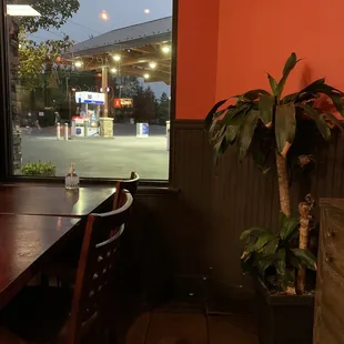 a table and chairs in front of a window