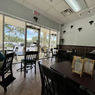 a woman sitting at a table in a restaurant