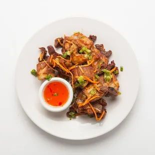 a plate of food on a white table