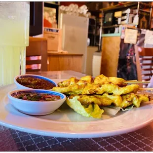 Chicken Sate on skewer.