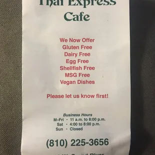 Front of menu with hours address and phone number