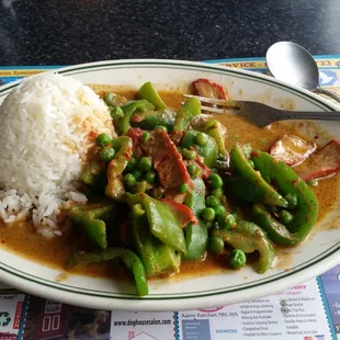 #13 green peppers and peas with coconut milk and pork. Pictured spice level is hot.