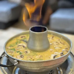 a pot of food on a stove